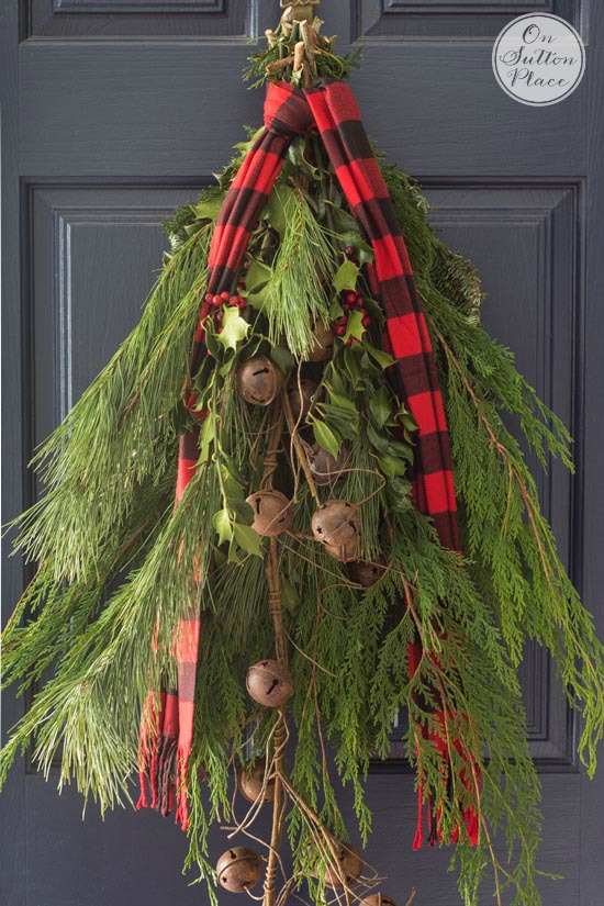 festive frugal christmas porch decor evergreen door arrangement with red plaid scarf