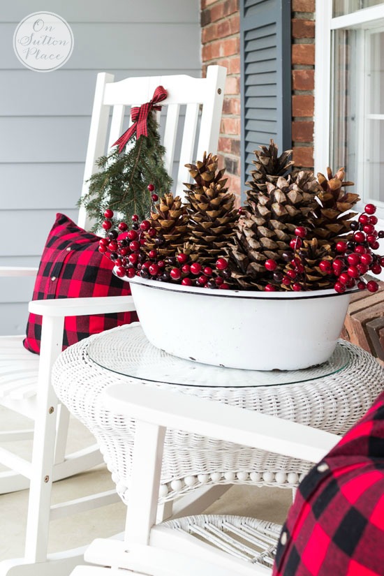 festive frugal christmas porch decor sitting area bucket of pinecones