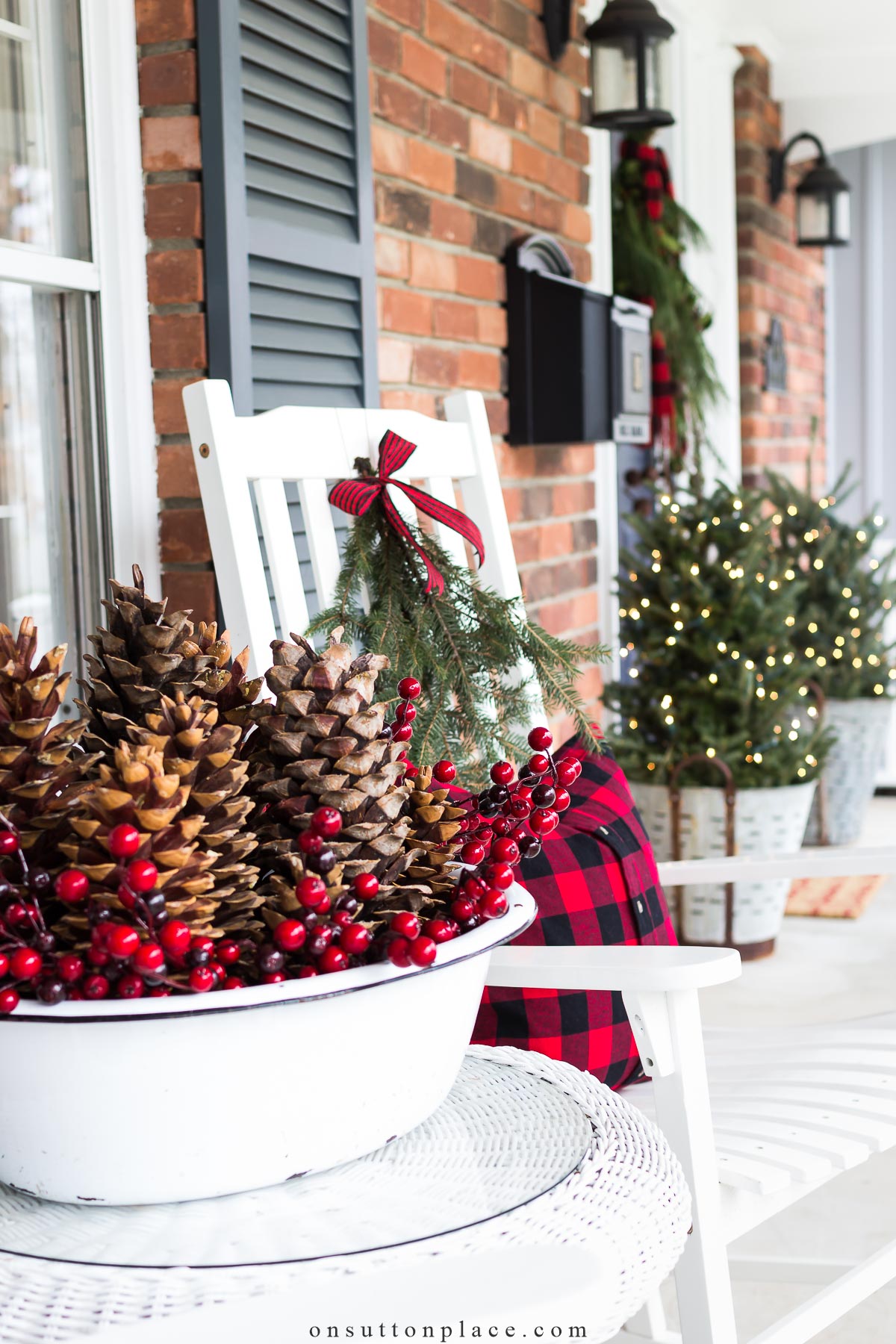 https://www.onsuttonplace.com/wp-content/uploads/2015/12/christmas-porch-decor-with-pine-cones-2023.jpg