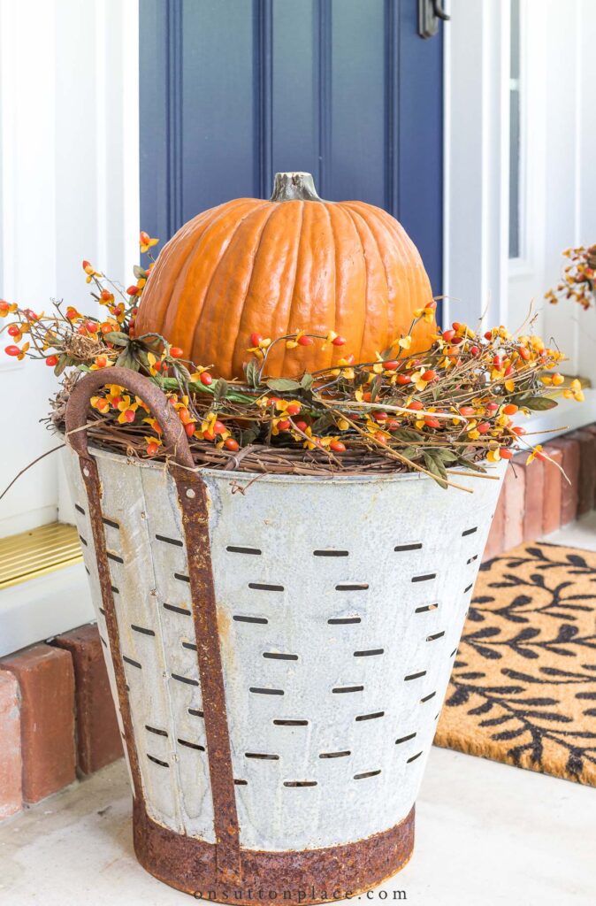 DIY Fall Olive Bucket Pumpkin Planters - On Sutton Place