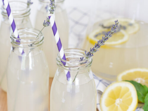 https://www.onsuttonplace.com/wp-content/uploads/2018/07/lavender-lemonade-in-bottles-with-purple-and-white-straws-500x375.jpg