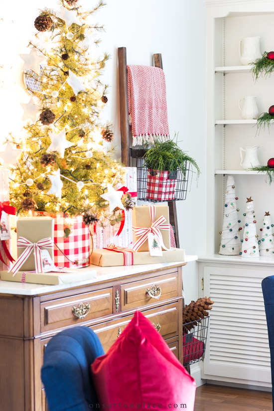 https://www.onsuttonplace.com/wp-content/uploads/2018/12/tabletop-christmas-tree-on-dresser-in-living-room.jpg