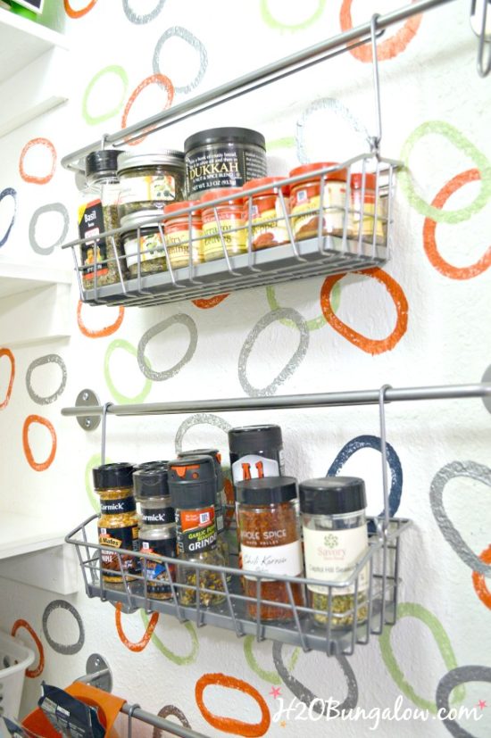 https://www.onsuttonplace.com/wp-content/uploads/2020/01/Organized-spice-rack-on-a-wall-saves-space-in-a-small-kitchen-H2OBungalow-e1579290726650.jpg