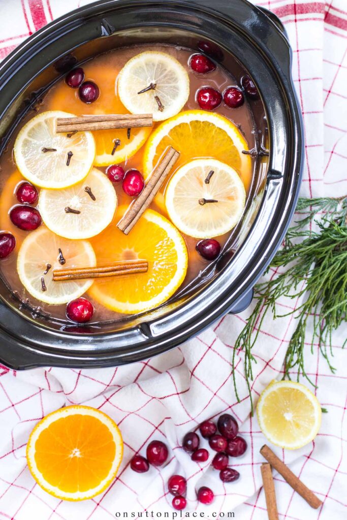 https://www.onsuttonplace.com/wp-content/uploads/2022/10/homemake-wassail-in-slow-cooker-friendsgiving-idea-683x1024.jpg