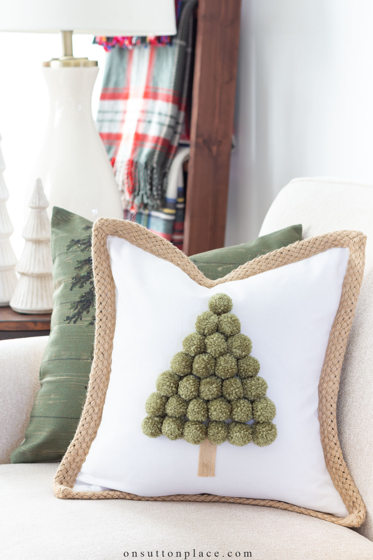 Christmas Tree Pillow Tutorial - Arrange the pom poms on the pillow front  to your liking - WeAllSew