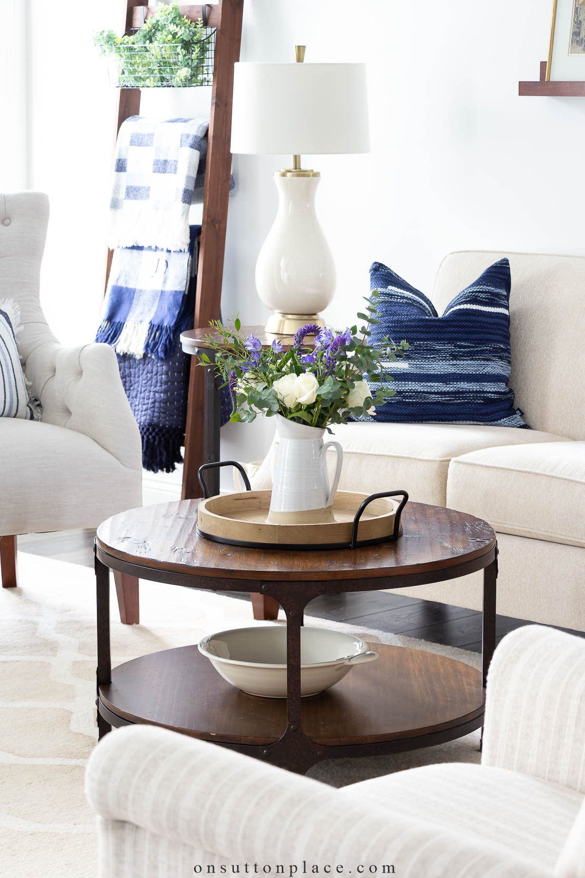 https://www.onsuttonplace.com/wp-content/uploads/2023/01/declutter-your-home-neutral-living-room-with-blue-accents.jpg