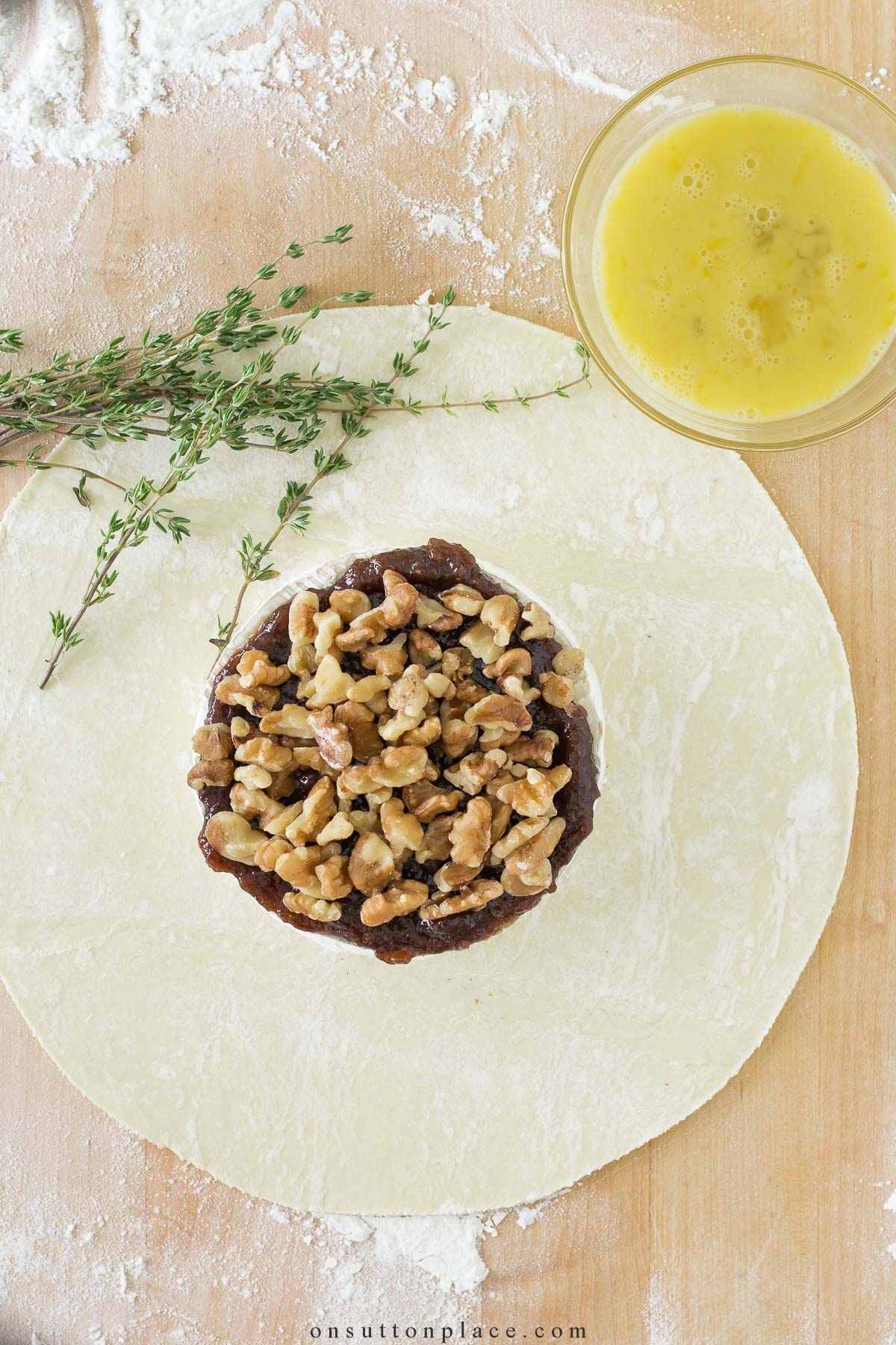 https://www.onsuttonplace.com/wp-content/uploads/2023/08/assembling-fig-walnut-baked-brie-2023.jpg