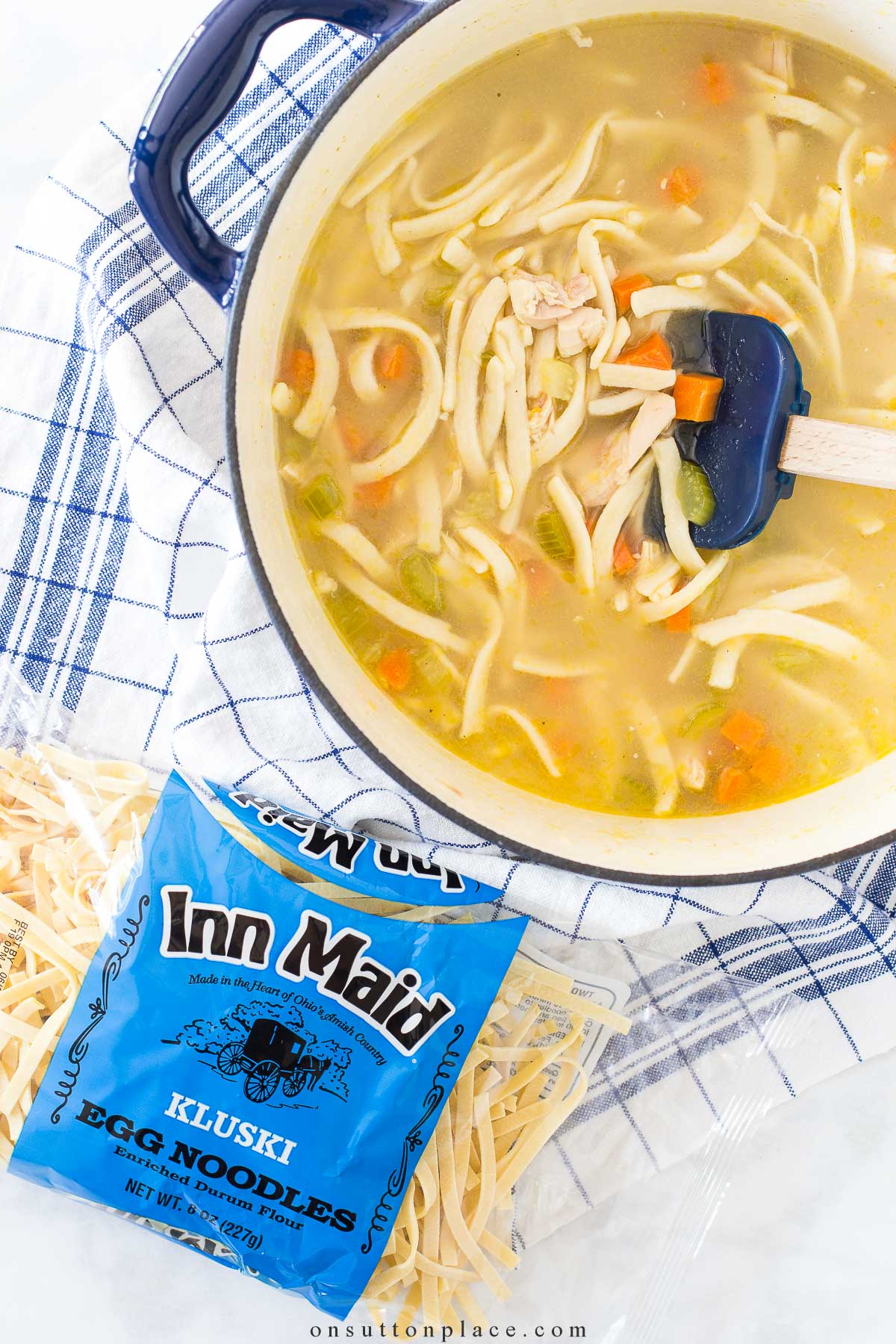 https://www.onsuttonplace.com/wp-content/uploads/2023/09/chicken-noodle-soup-in-pot-with-bag-of-kluski-noodles-2023.jpg