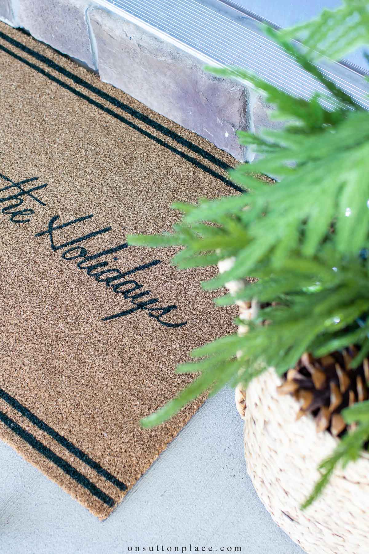 https://www.onsuttonplace.com/wp-content/uploads/2023/11/christmas-doormat-with-mini-tree.jpg